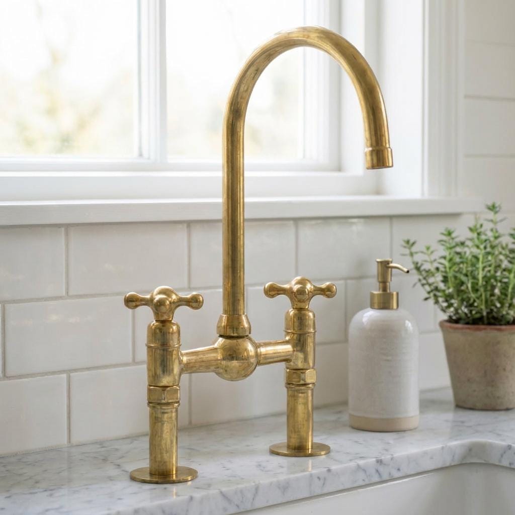 Traditional unlacquered brass bridge faucet with high arch spout
