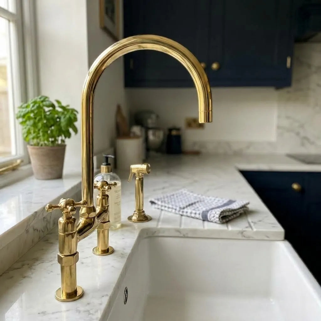 Unlacquered brass bridge kitchen faucet with cross handles and separate hand sprayer
