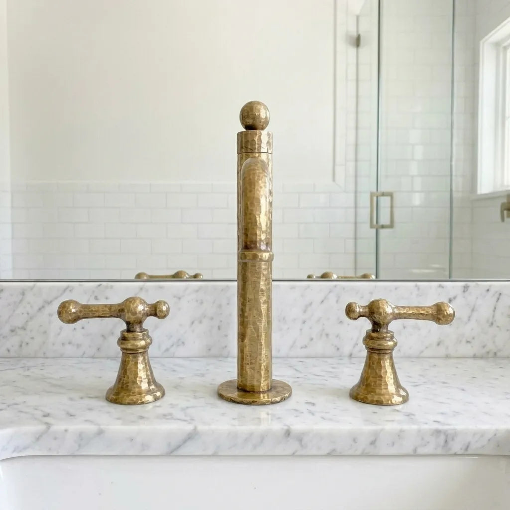 Solid brass widespread bathroom tap showcasing a faceted finish and elegant horizontal spout profile