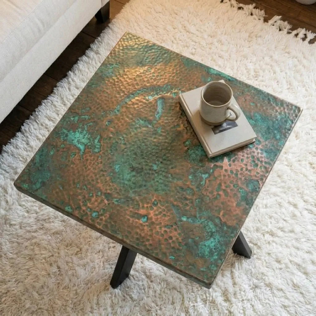 Artistic copper coffee table with oxidized green patina