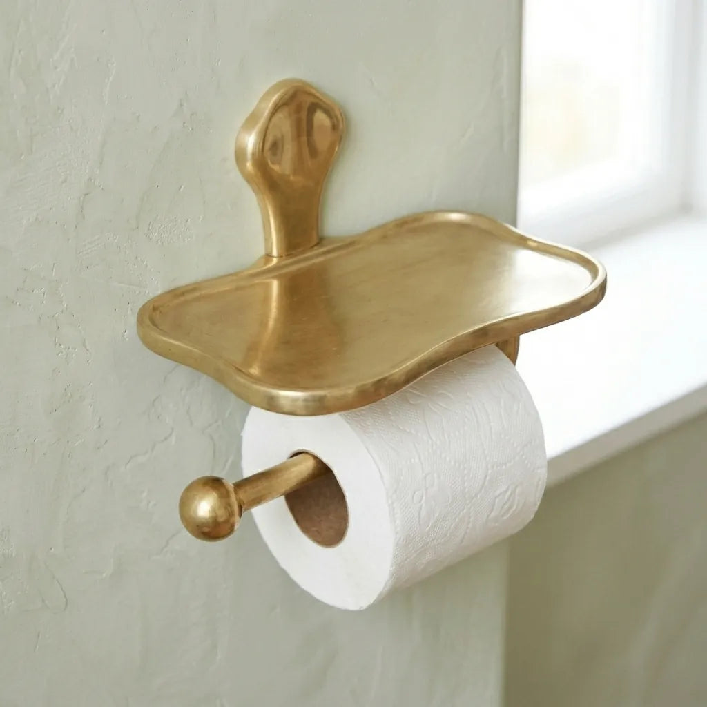 Luxury brass toilet roll holder featuring a built in shelf for phones, candles, hand towels, or small accessories