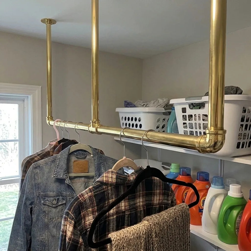 Suspended brass wardrobe rail for contemporary interiors