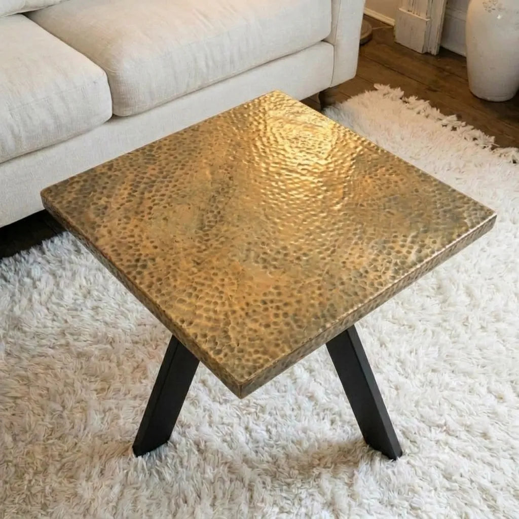 Minimalist hammered brass coffee table with seamless square tabletop