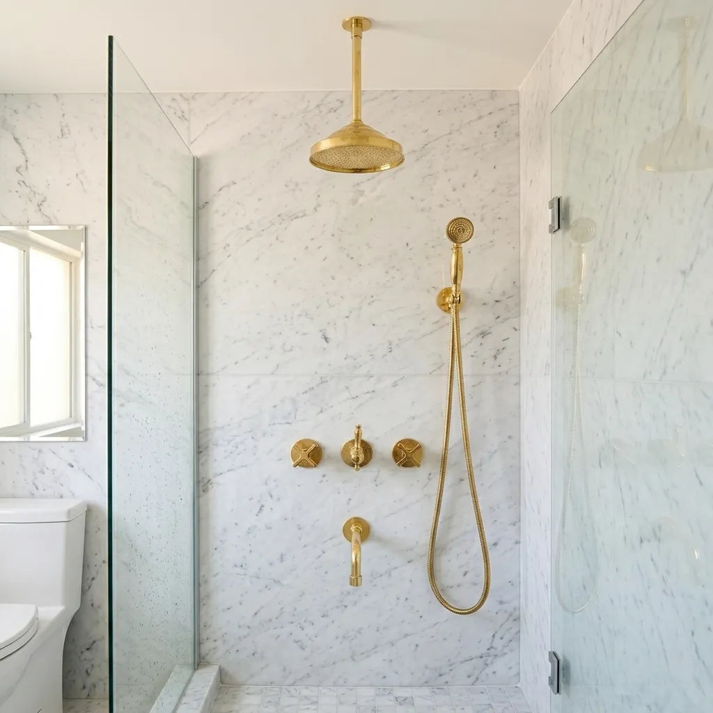 Unlacquered brass ceiling shower system with rain shower head, handheld sprayer, and integrated tub spout.