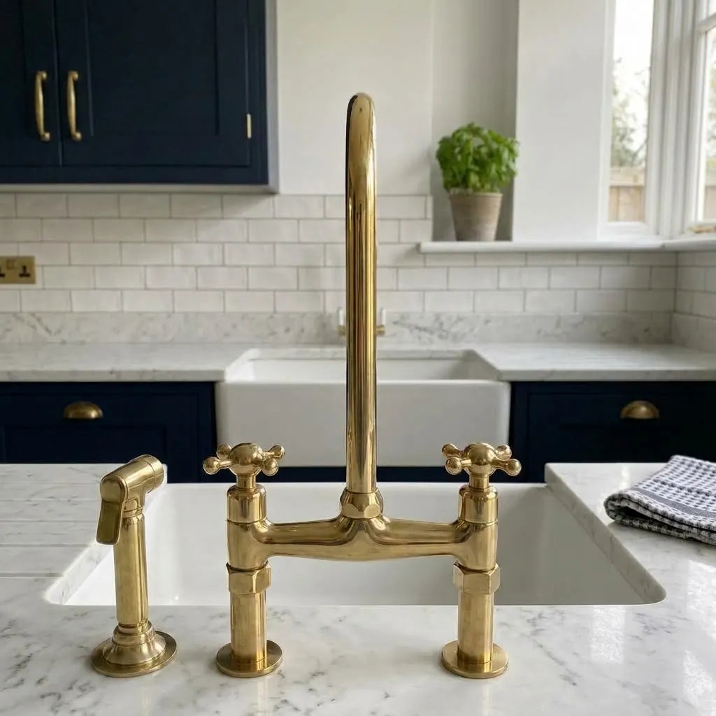 Brass bridge sink mixer with tall swan-neck spout and deck-mounted rinse spray
