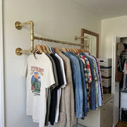 Heavy-duty solid brass clothes rack with reinforced wall supports