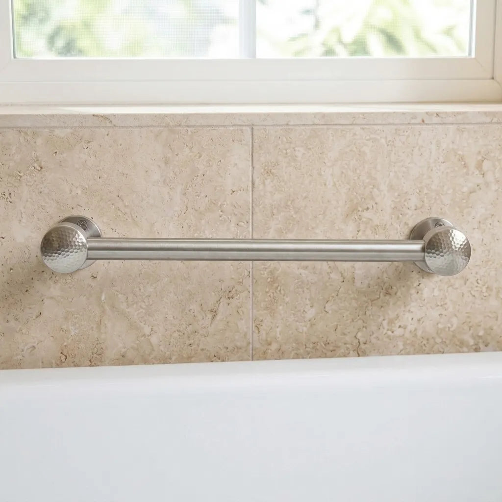 Wall-mounted chrome towel holder above a white bathtub