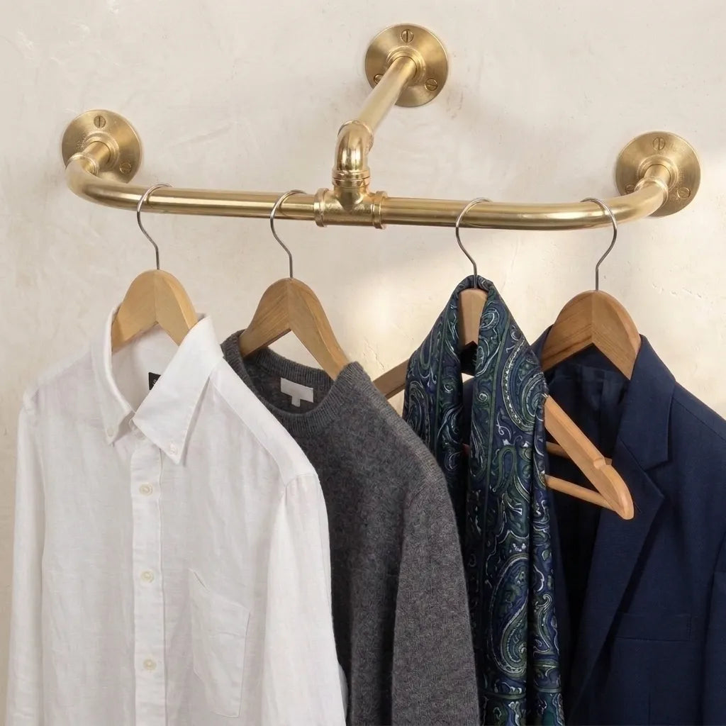 Solid brass three point ceiling clothes rail with dual wall supports for wardrobe storage.