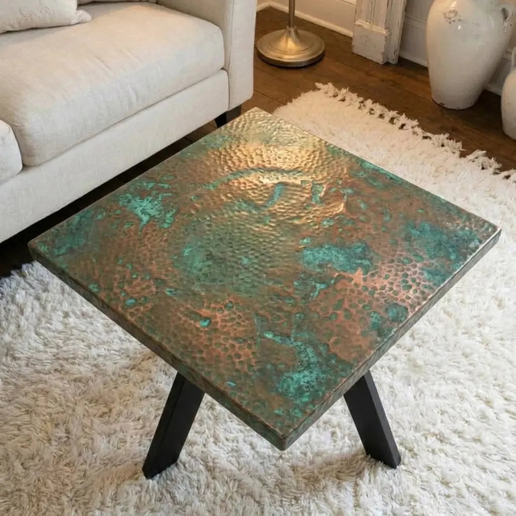 Hand-hammered verdigris copper coffee table with black steel base