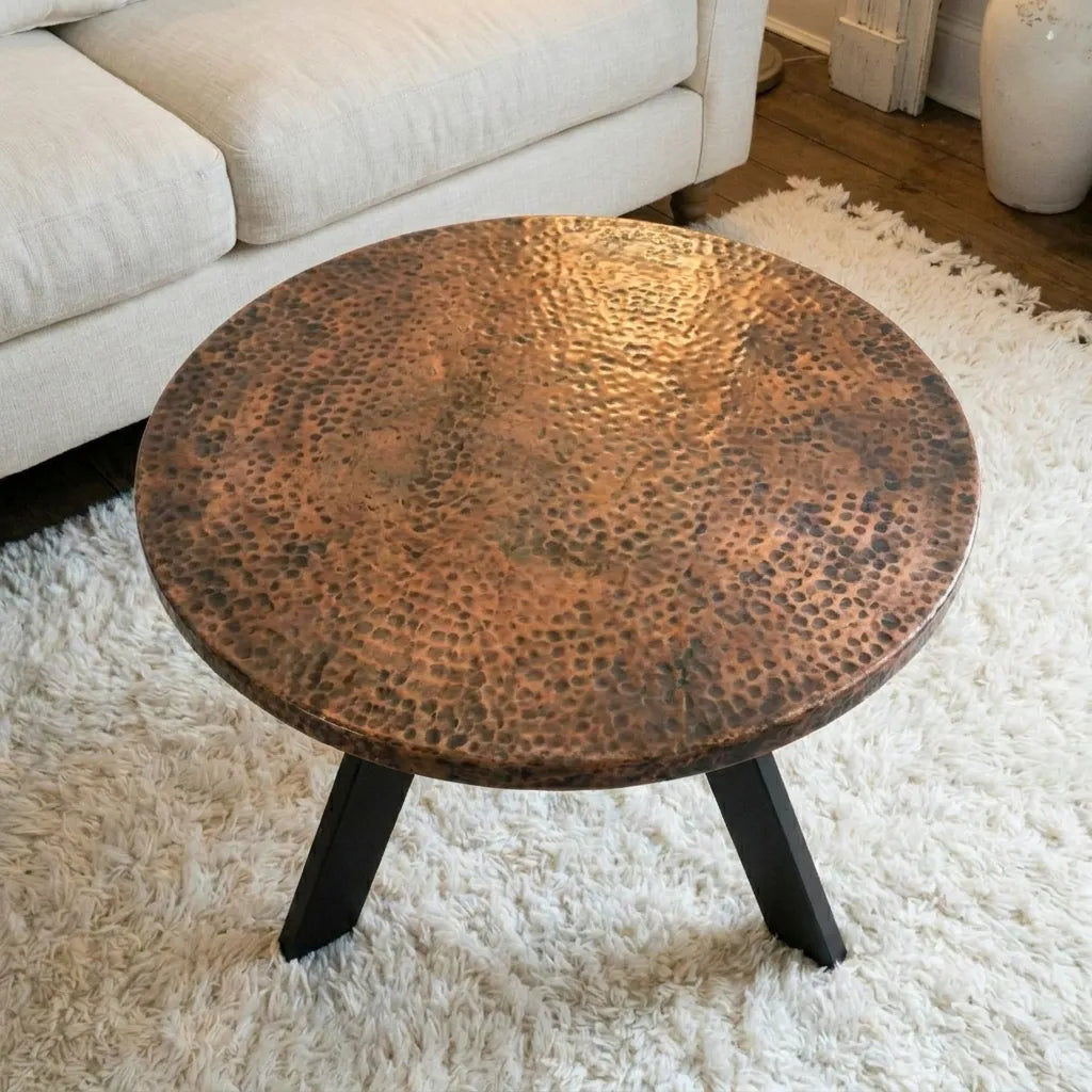 Round Hammered Copper Coffee Table with Rustic Patina Finish and Black Metal Legs