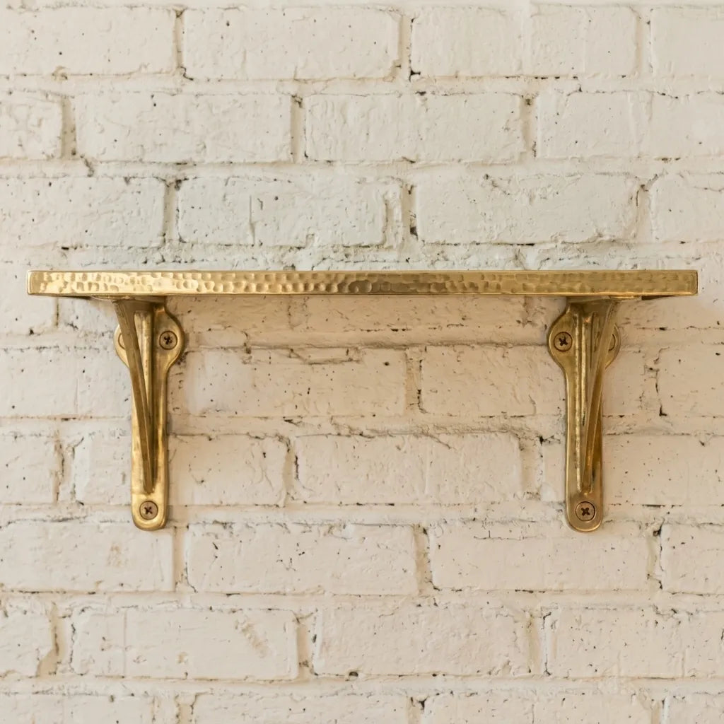Luxury hammered brass display shelf offering functional storage and warm metallic character for traditional and contemporary interiors