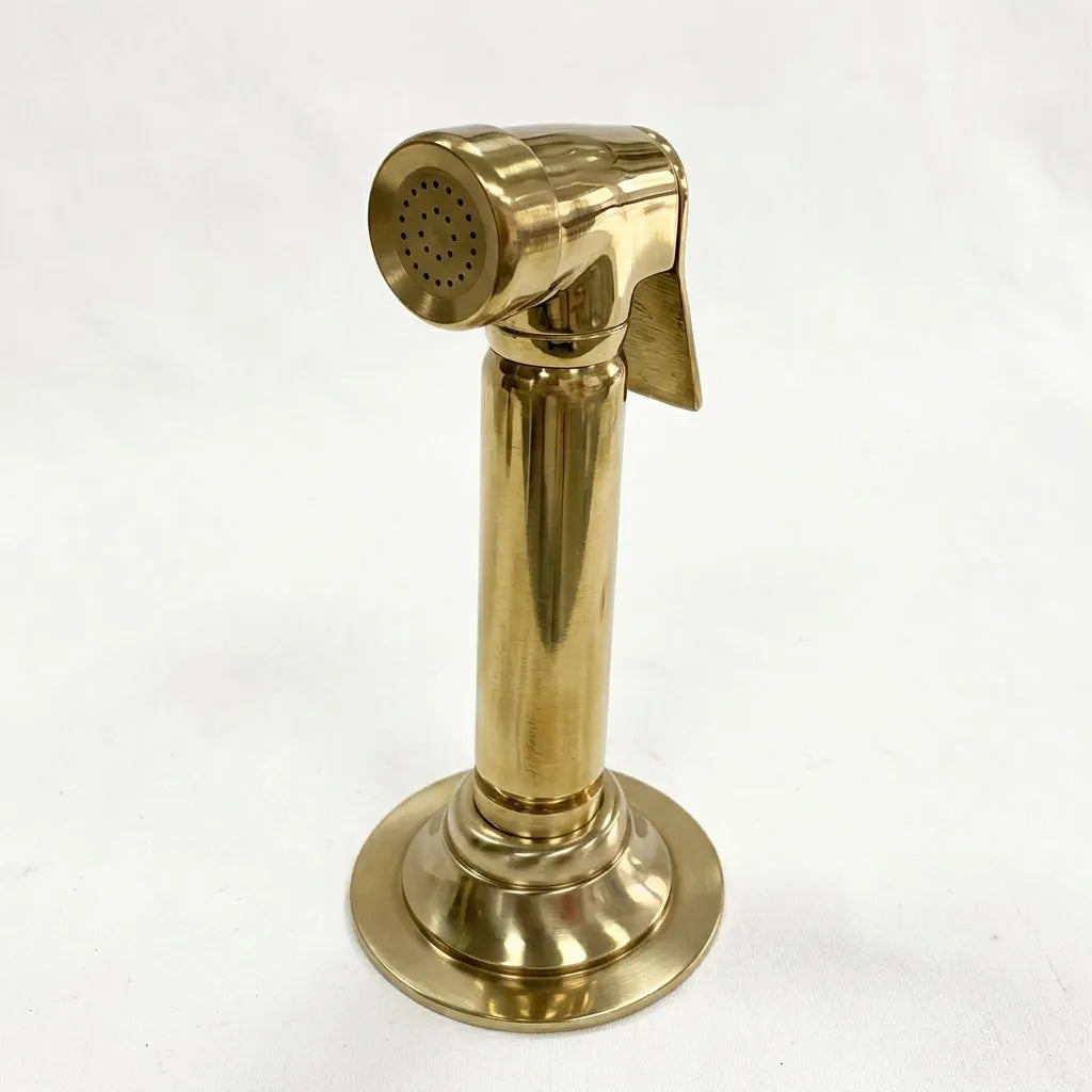 Unlacquered brass kitchen hand sprayer with trigger lever and deck-mounted holder