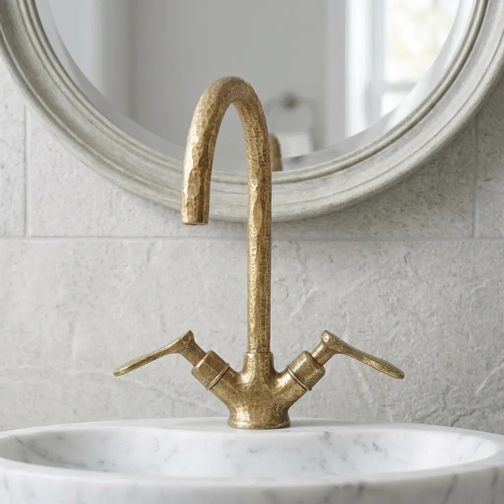 Luxury hammered brass bathroom faucet with elevated spout design, crafted for elegant powder rooms and custom vanities