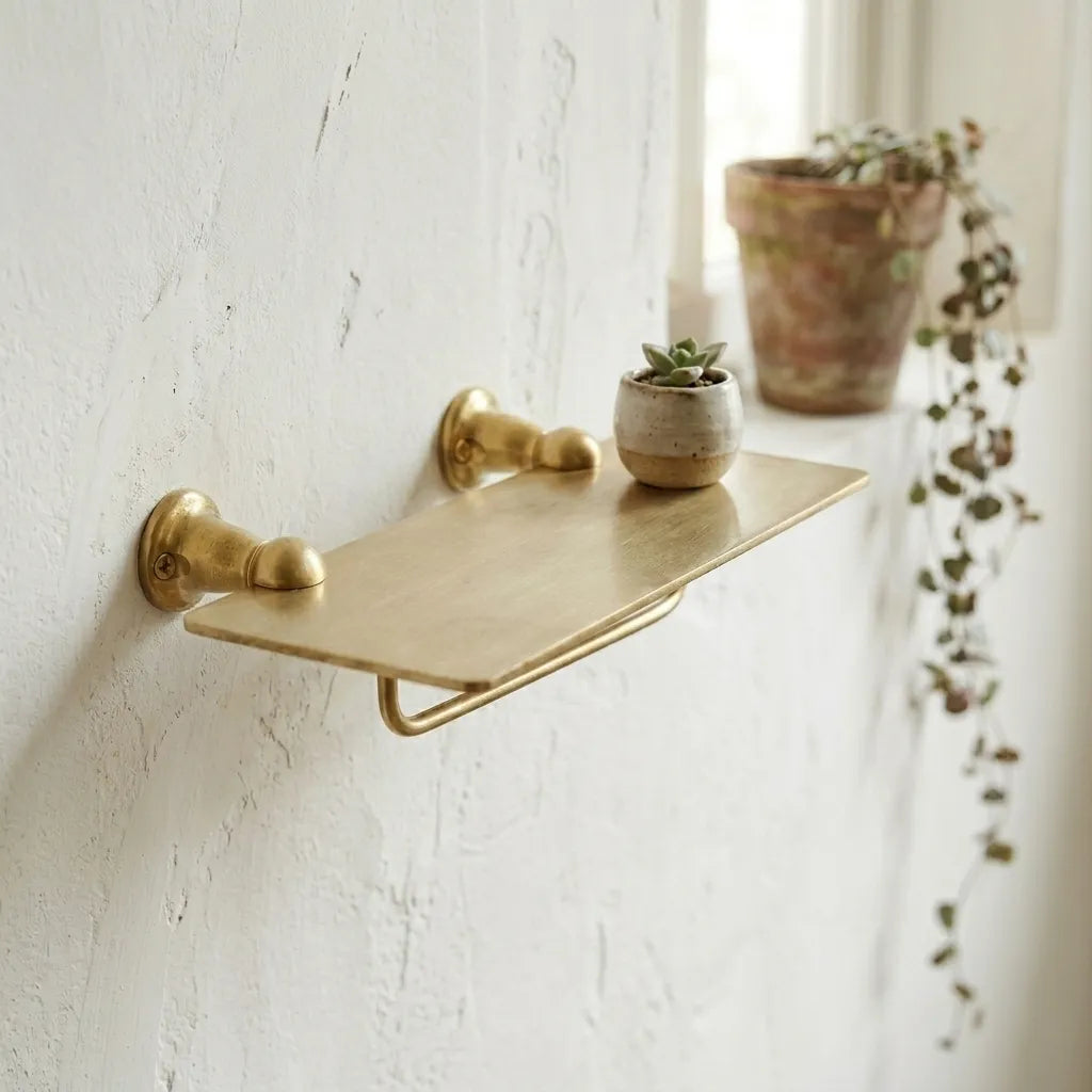 Luxury brass towel rack with upper storage platform, combining functional towel access and elegant bathroom storage