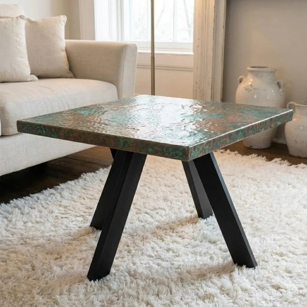 Square coffee table featuring a green patina copper tabletop