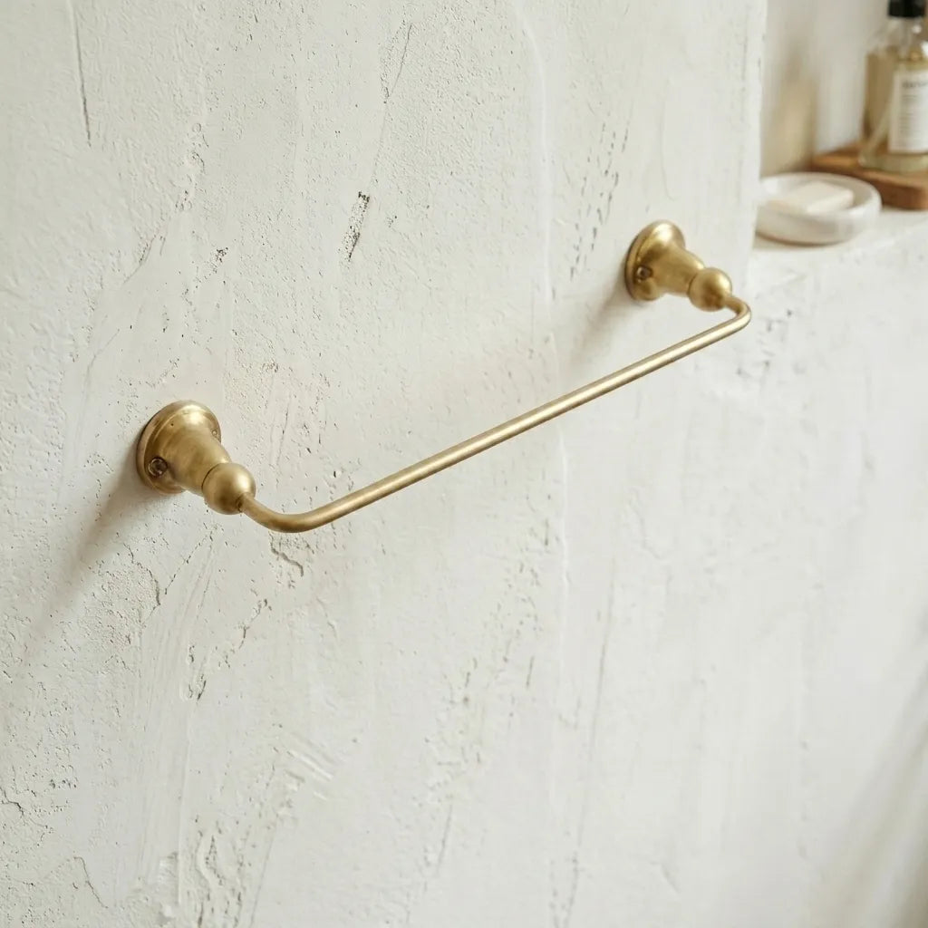 Wall mounted brass towel rail designed for guest bathrooms, powder rooms, and classic vanity spaces