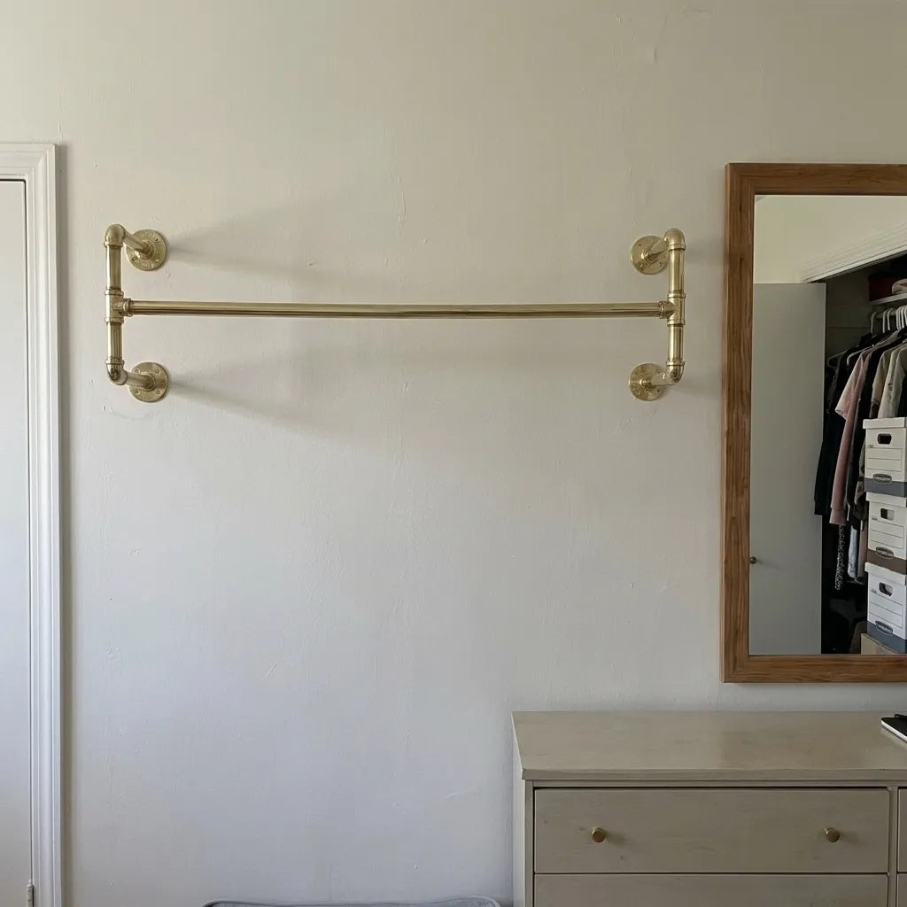 Handcrafted brass clothing rack for walk-in closets