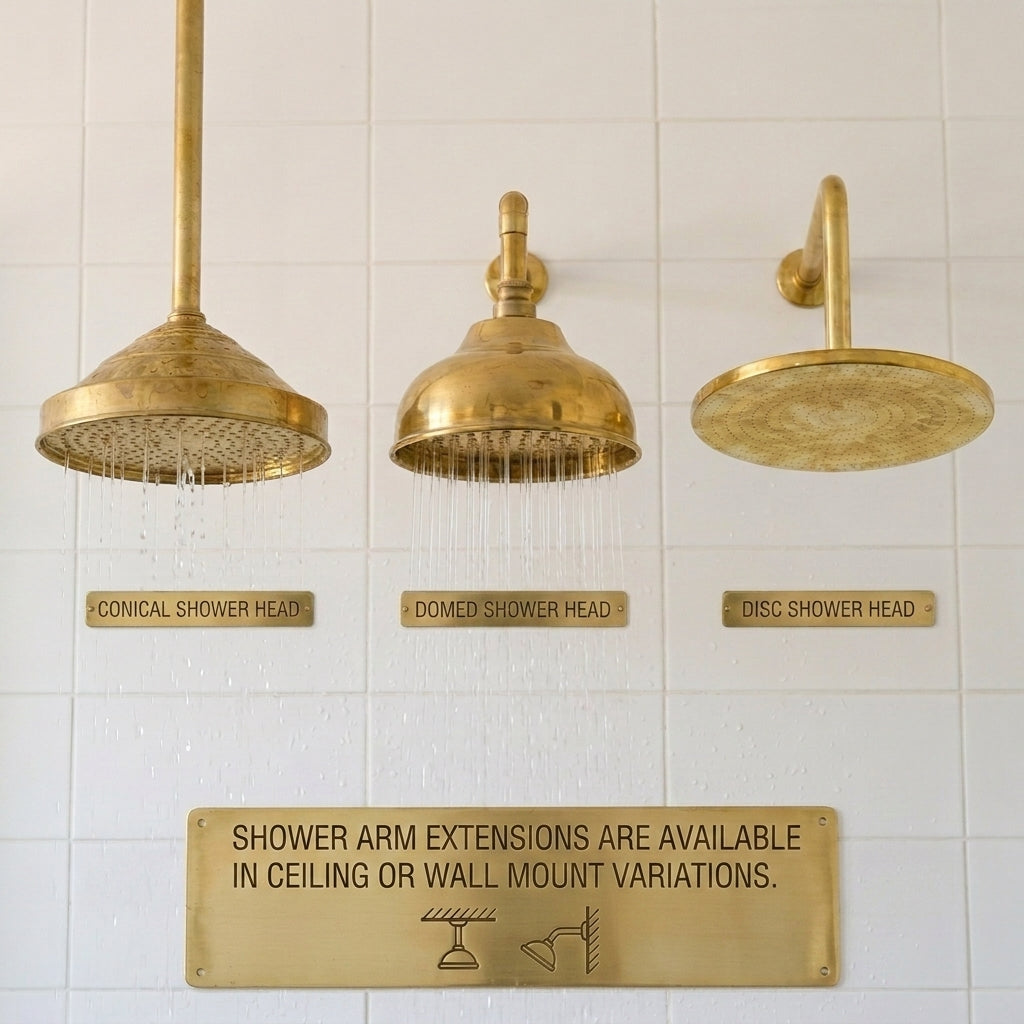 Three solid brass rain shower head styles including conical, domed, and flat disc designs for custom shower systems.