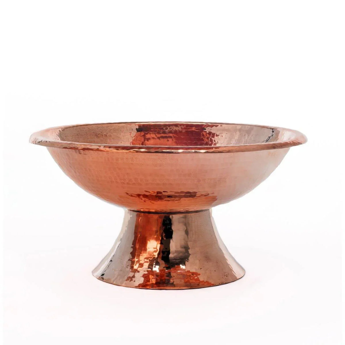 Rustic handcrafted copper fruit bowl with hammered finish and raised pedestal base, ideal for farmhouse and traditional interiors.