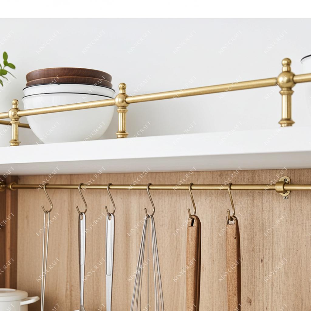 Luxury brass shelf guard rail for open kitchen storage and display shelving.