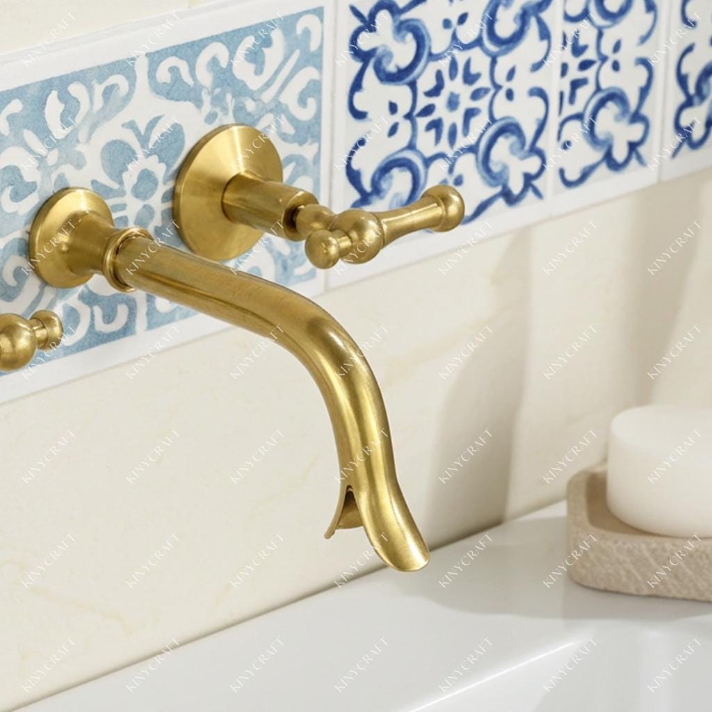 Handmade solid brass wall mounted sink faucet with traditional lever handles.