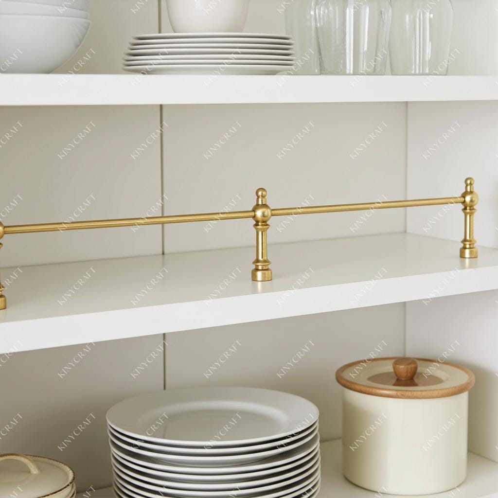 Traditional brass cabinet gallery rail securing dishes on open shelves.