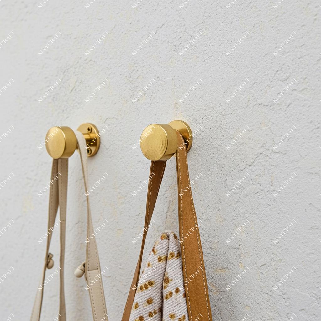 Luxury solid brass robe hooks with hammered decorative knobs for organizing towels, jackets, and everyday accessories.