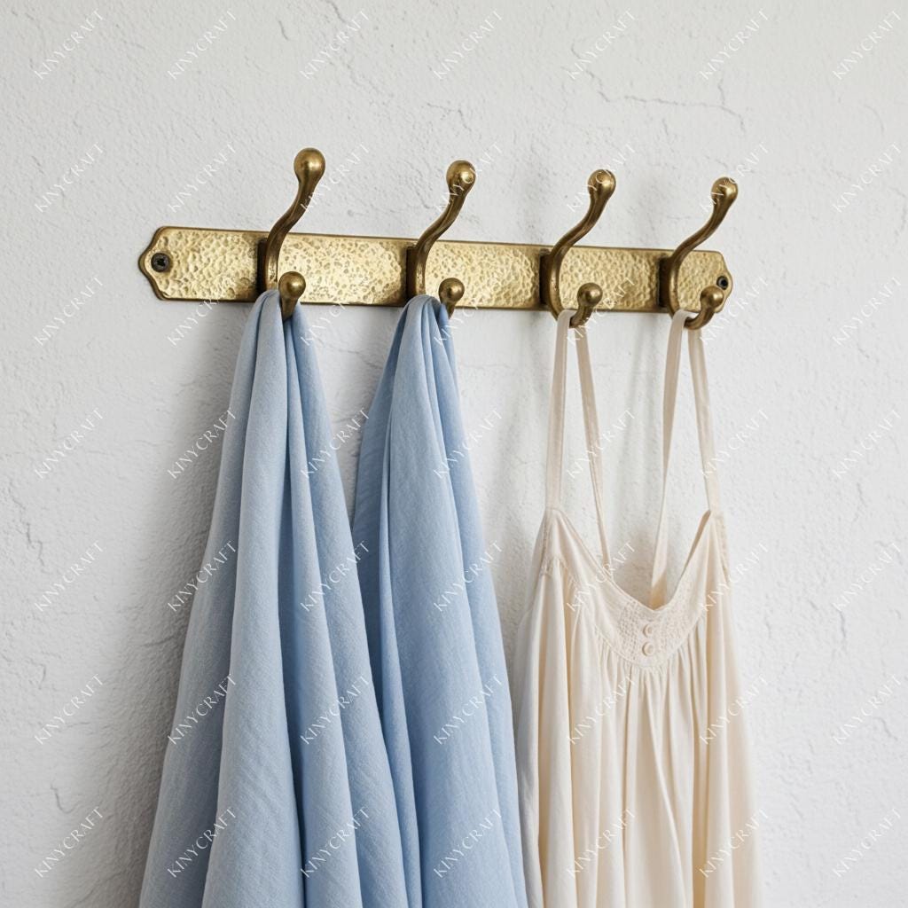 Solid brass wall hook rack with three double hooks and hammered backplate for coats, towels, hats, and bags.