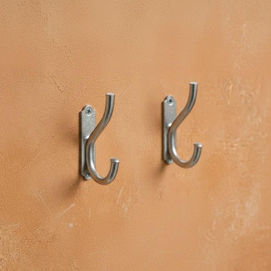 Contemporary chrome storage hook installed on an interior wall.