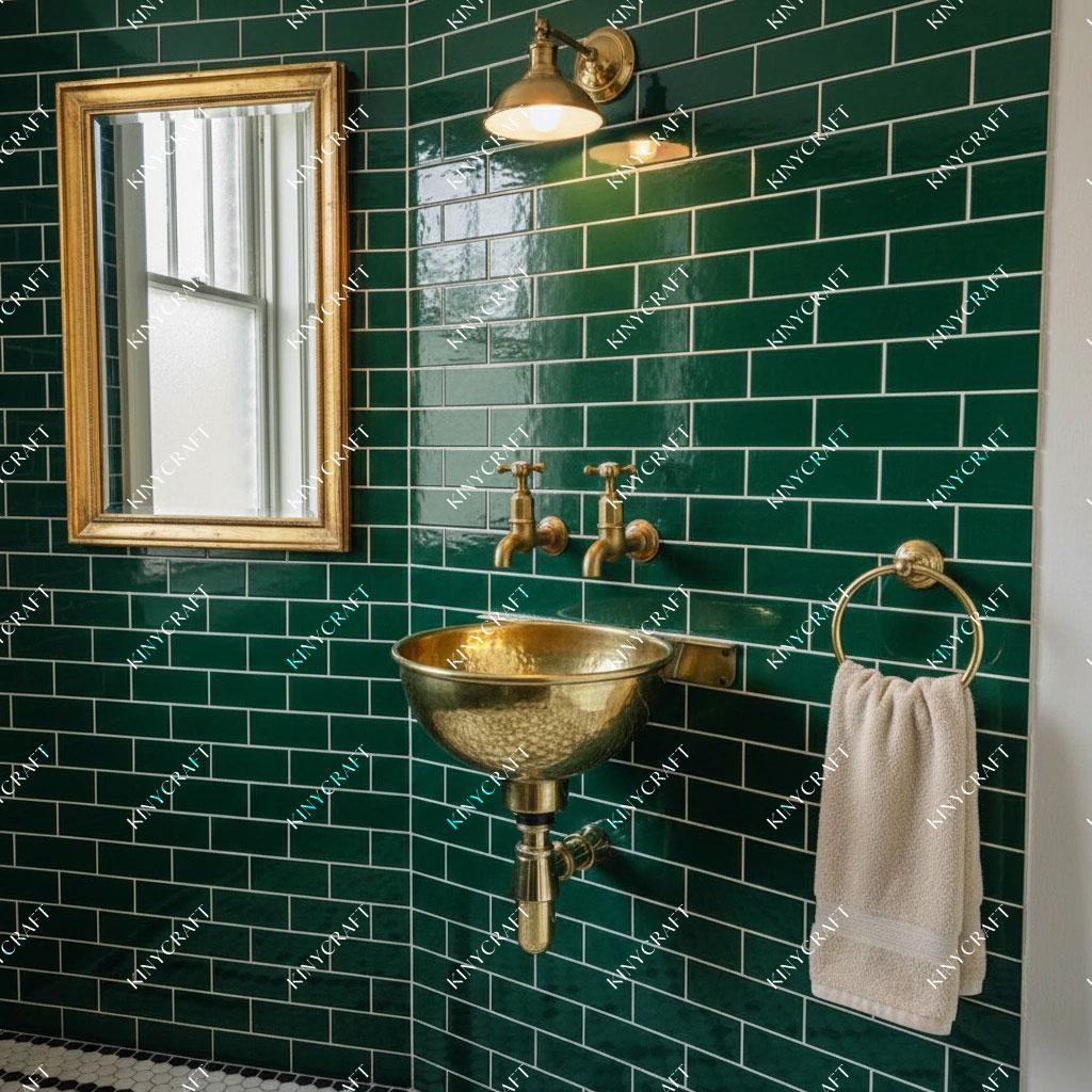 Vintage-style hammered brass wall-mounted sink with exposed drain assembly and artisan handcrafted finish.