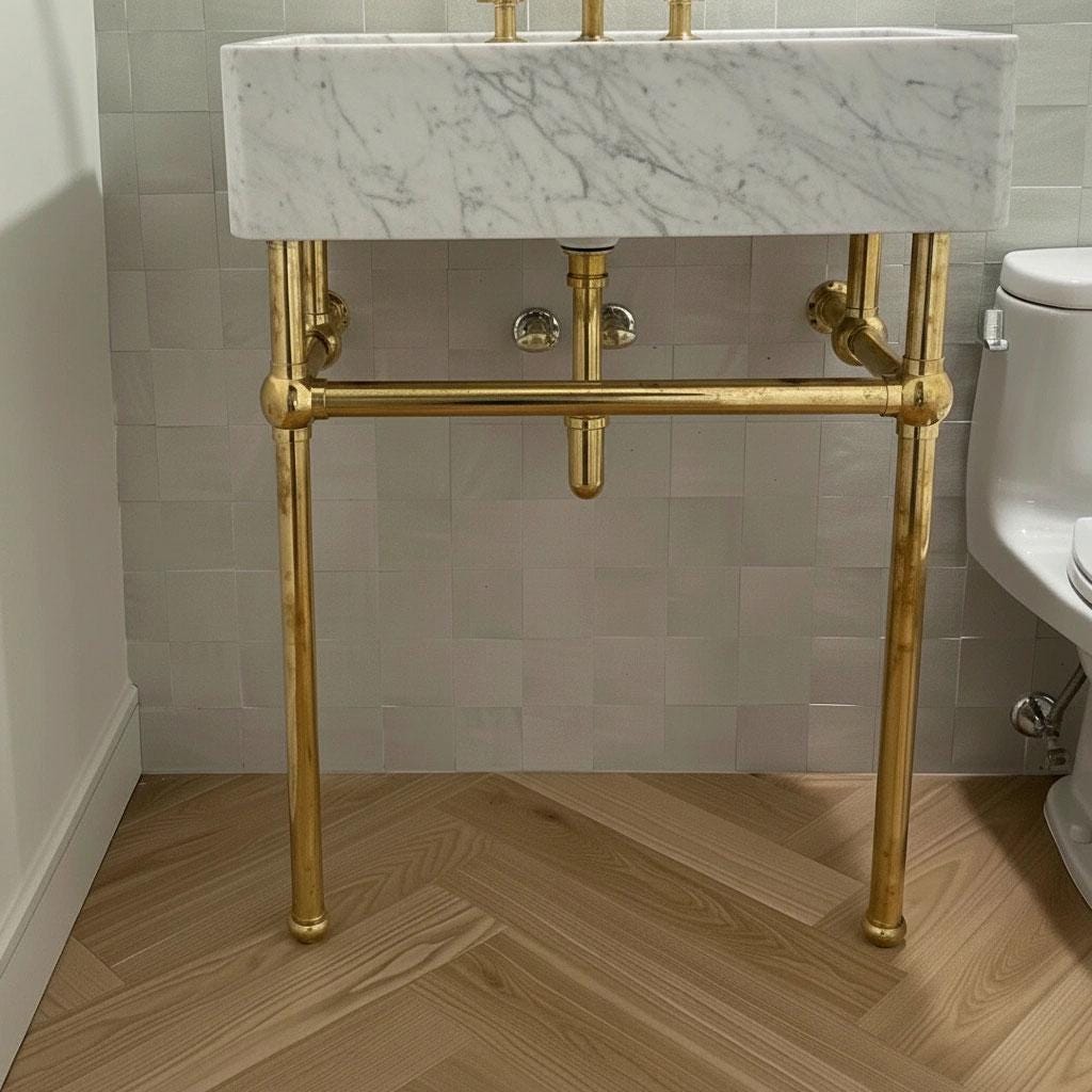 Handmade brass bathroom vanity stand with an open-frame console design.