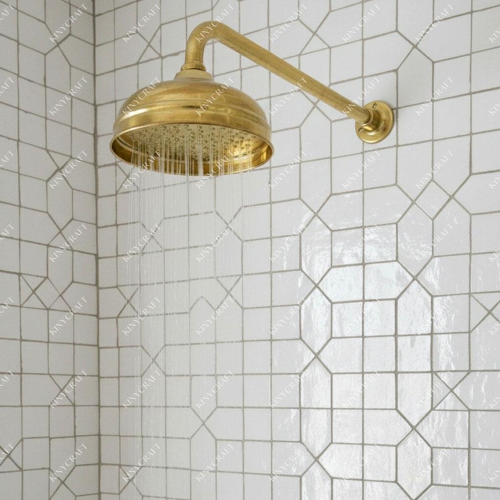 Solid brass rainfall shower system with exposed wall arm and minimalist handles