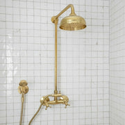 Unlacquered brass exposed shower system with rain shower head and handheld sprayer