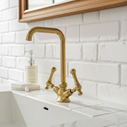 Unlacquered brass single hole bathroom faucet with square gooseneck spout and cross handles