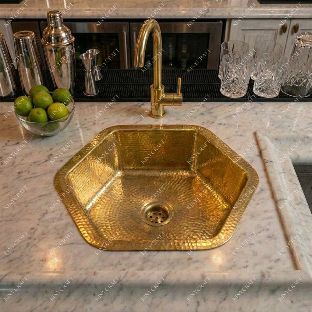 Solid brass prep sink with hand-hammered interior and decorative rim.