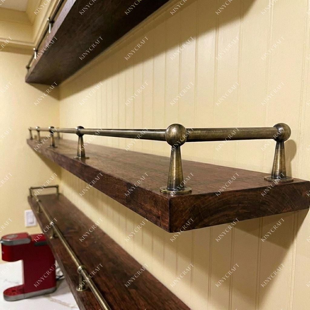 Traditional brass gallery rail protecting dishes and decorative items on floating shelves.