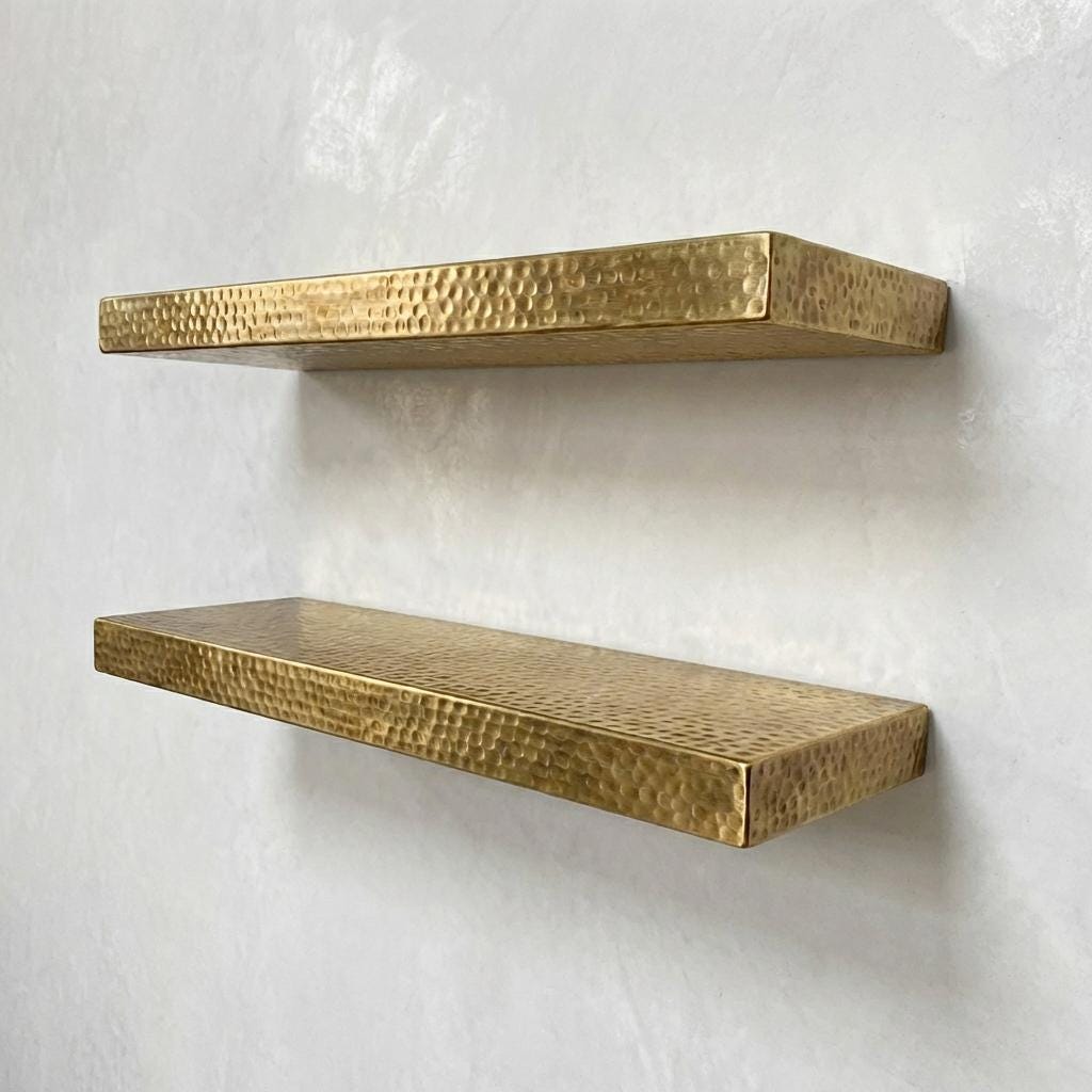 Handmade hammered brass display shelf for books, plants, and home décor.
